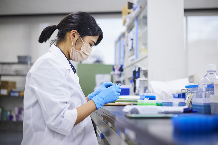 Photo shows a woman researching in a lab/Getty Images