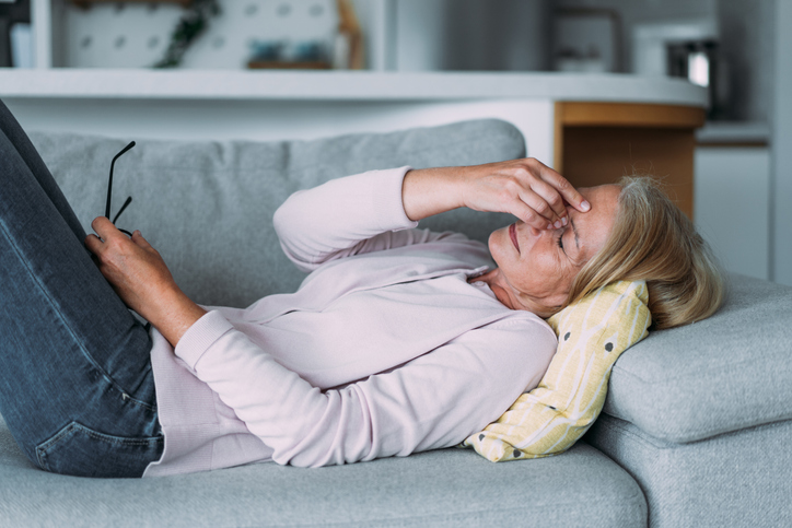 Photo shows woman on a couch/