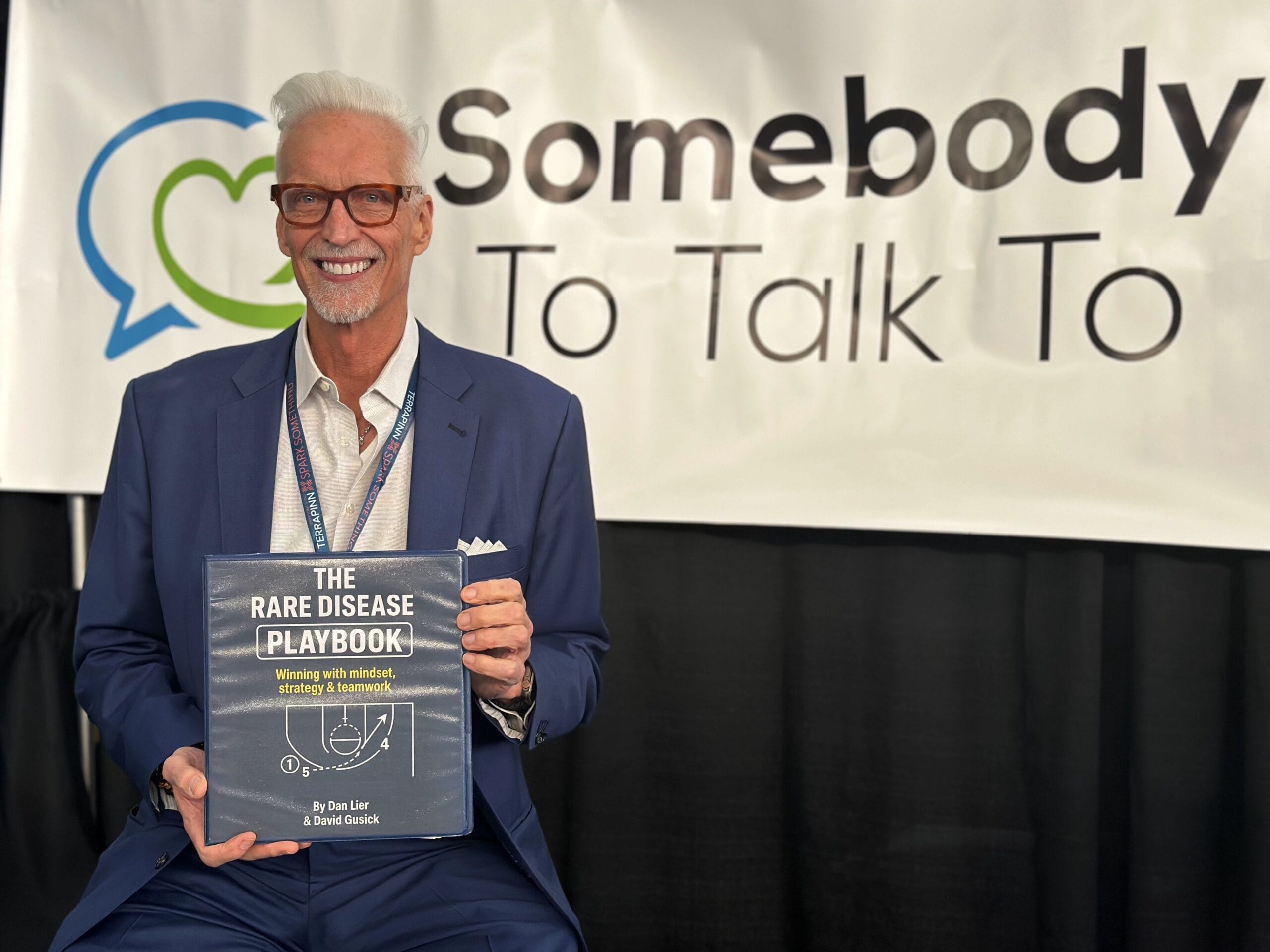 Dan Lier holding a copy of the 