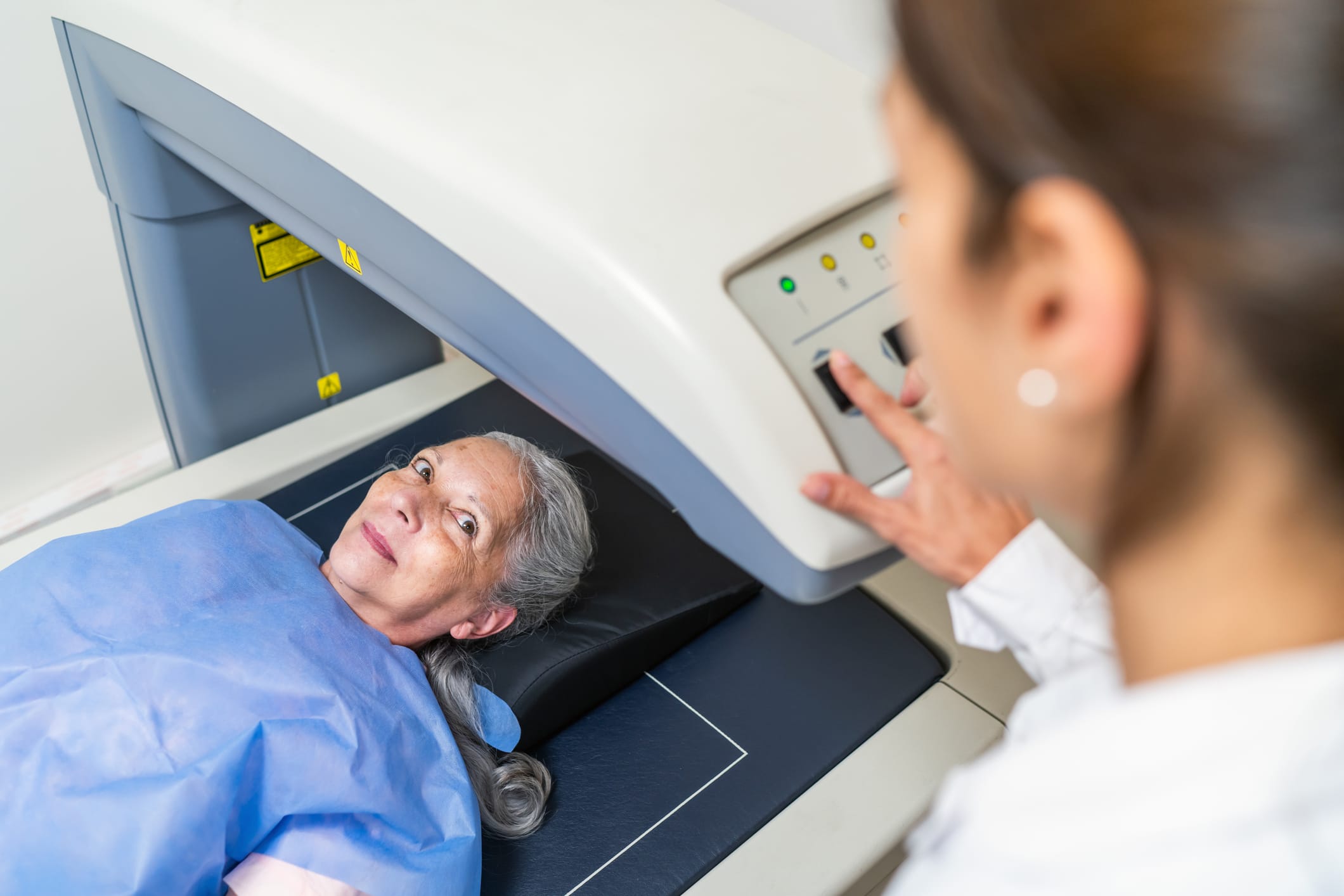 Older woman getting a bone scan