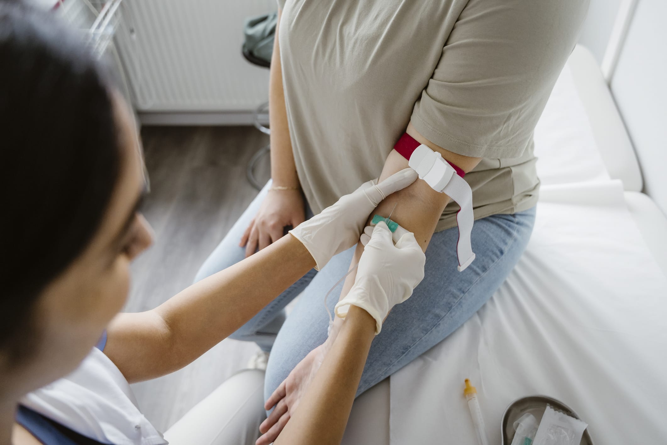 Patient in a medical office having blood drawn