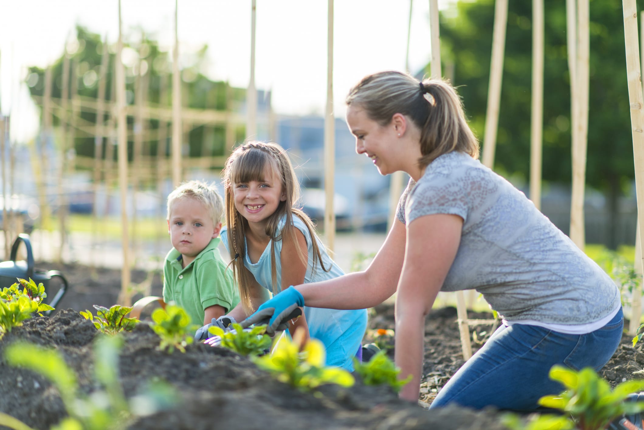 Mother gardening with children